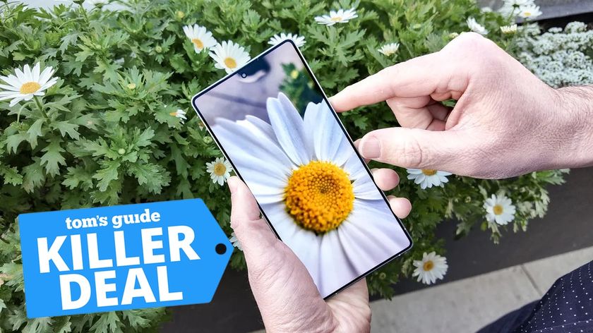 Samsung Galaxy S25 Ultra held in hand with a killer deal tag