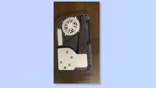 Image of the PS5 with the cover removed and the insides exposed. 