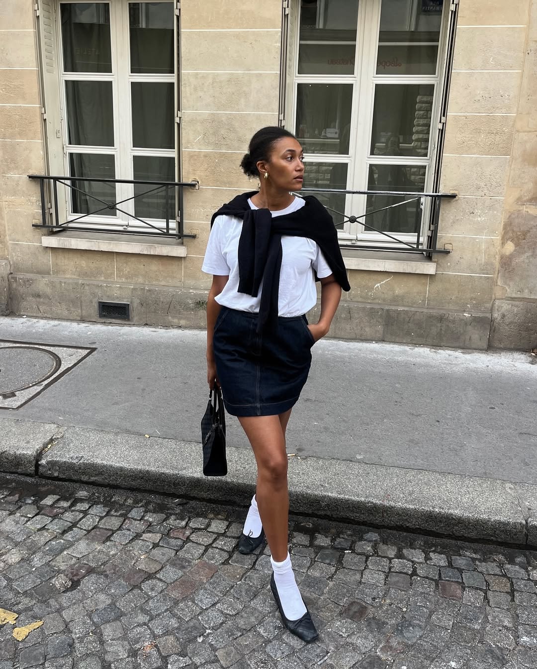 Lena in a denim mini skirt