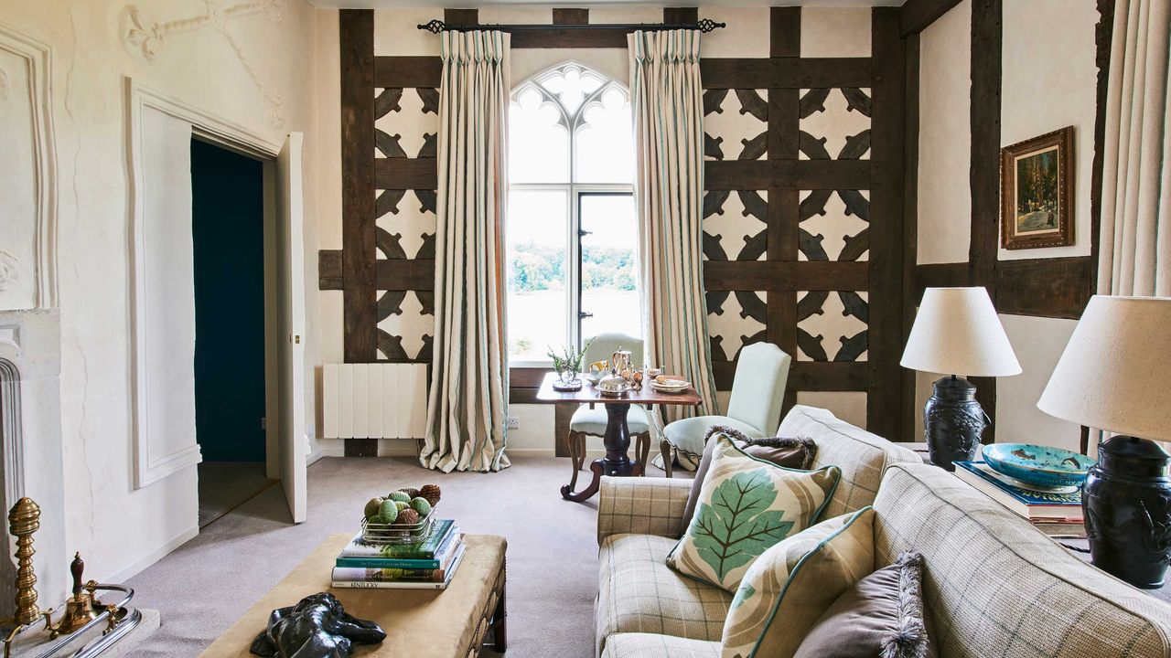 living room with paneling and large window