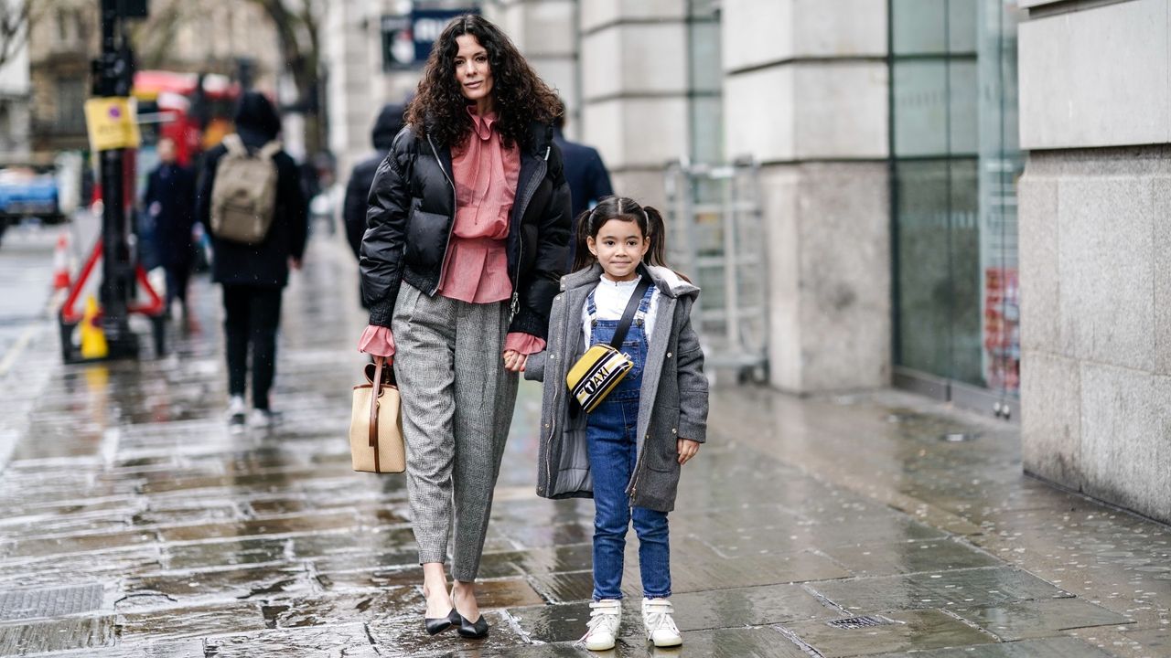 mother and daughter walking down the street