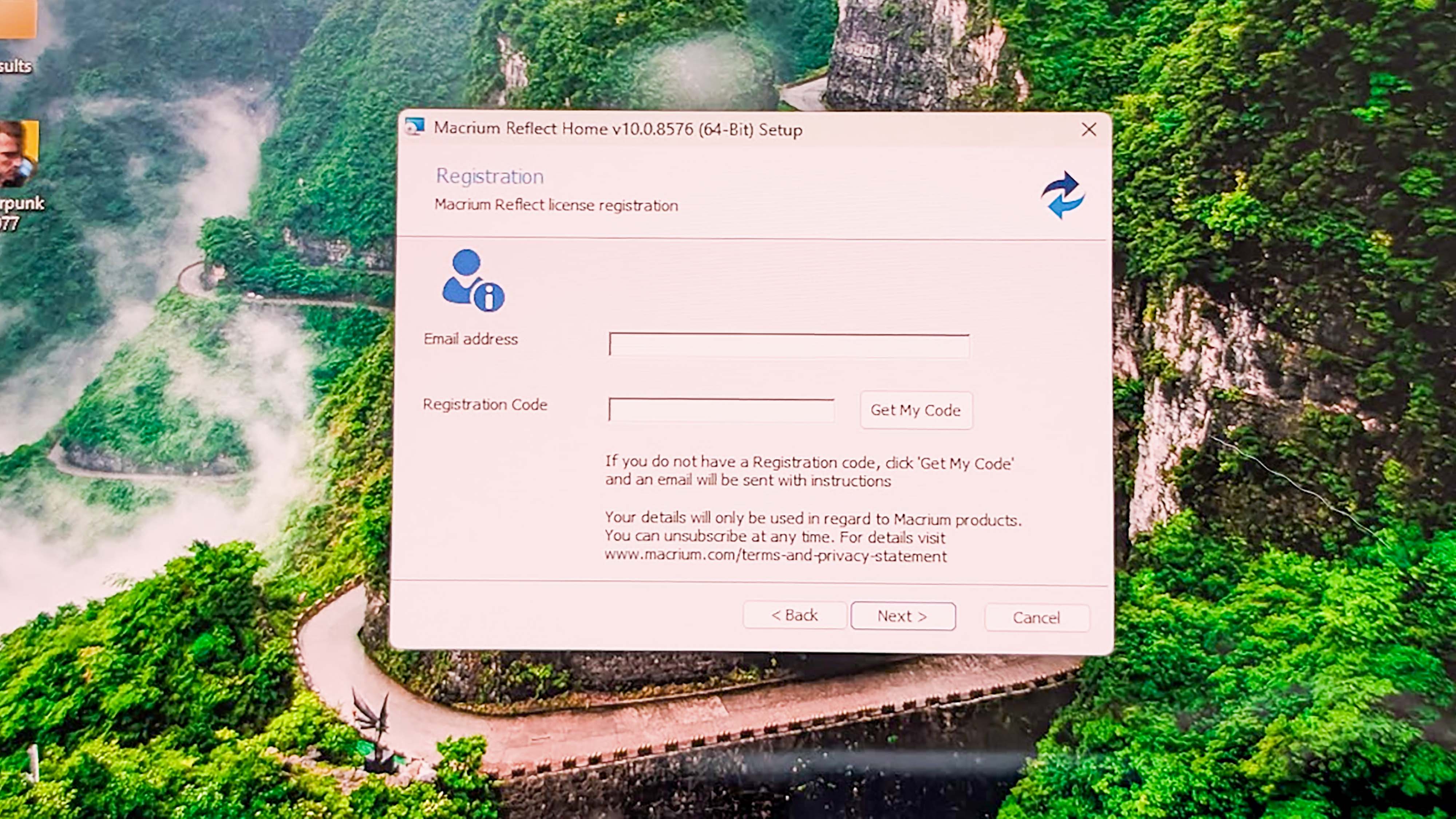 The Macrium Reflect installation window with places to enter an email address and a registration code.