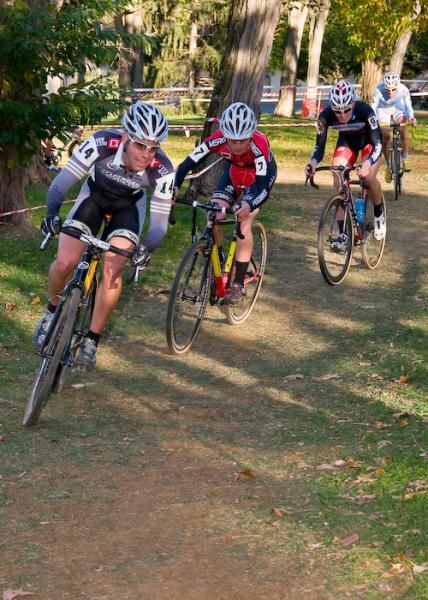 The chase group winds its way through a wooded section.