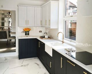 tuxedo kitchen with black and white cupboards