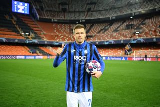 Josip Iličić poses with the match ball after scoring four goals for Atalanta against Valencia in March 2020, with Mestalla empty due to Covid-19 restrictions.