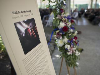 A memorial tribute from the Smithsonian is seen at the entrance of a private memorial service celebrating the life of Neil Armstrong, Aug. 31, 2012, at the Camargo Club in Cincinnati. Armstrong, the first man to walk on the moon during the 1969 Apollo 11 mission, died Saturday, Aug. 25. He was 82.