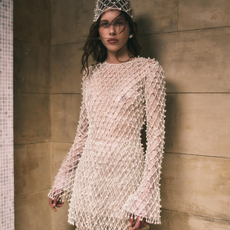 Woman wearing beaded Danielle Frankel Studio tunic.