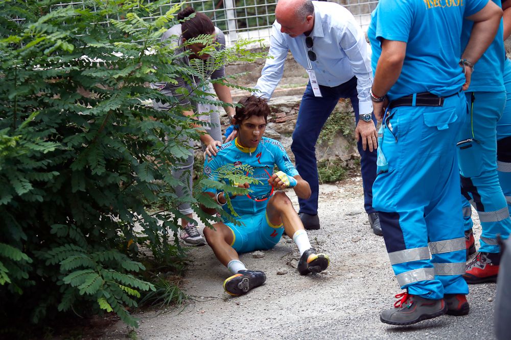 Medics attend Diego Rosa (Astana) after crashing at Giro della Toscana