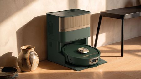 Shark PowerDetect UV Reveal 2-In-1 Vac & Mop in green and bronze, in dock in hallway