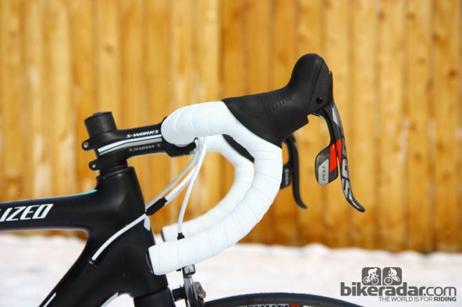 The compact-bend Specialized carbon bars are comfortable and light with good stiffness that complements the frameset's personality.