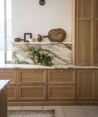 Modern kitchen with wood cabinet and marble