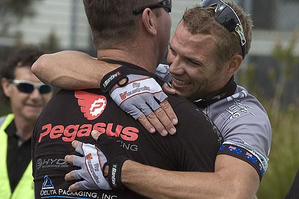 Great stuff mate: Fly V Australia team-manager Henk Vogels congratulates Jonathan Cantwell on his stage victory in East Devonport.