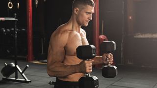 Man doing hammer curls with dumbbells