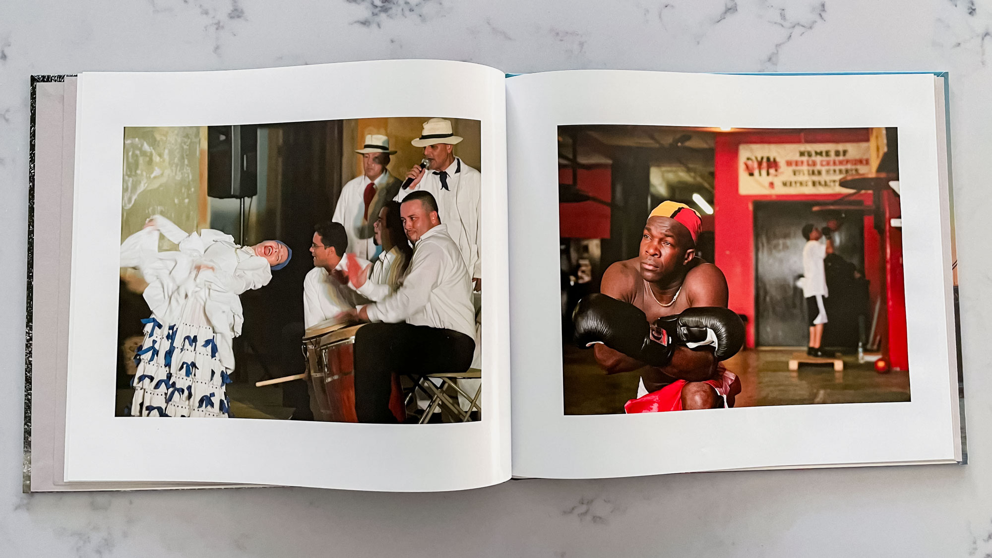 A Blurb photo book open on a countertop surface