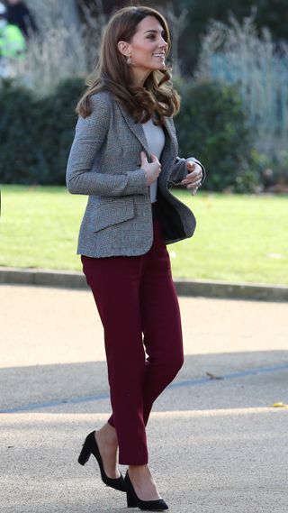 Catherine, Princess of Wales walks as she arrives to attend the Shout's Crisis Volunteer celebration event