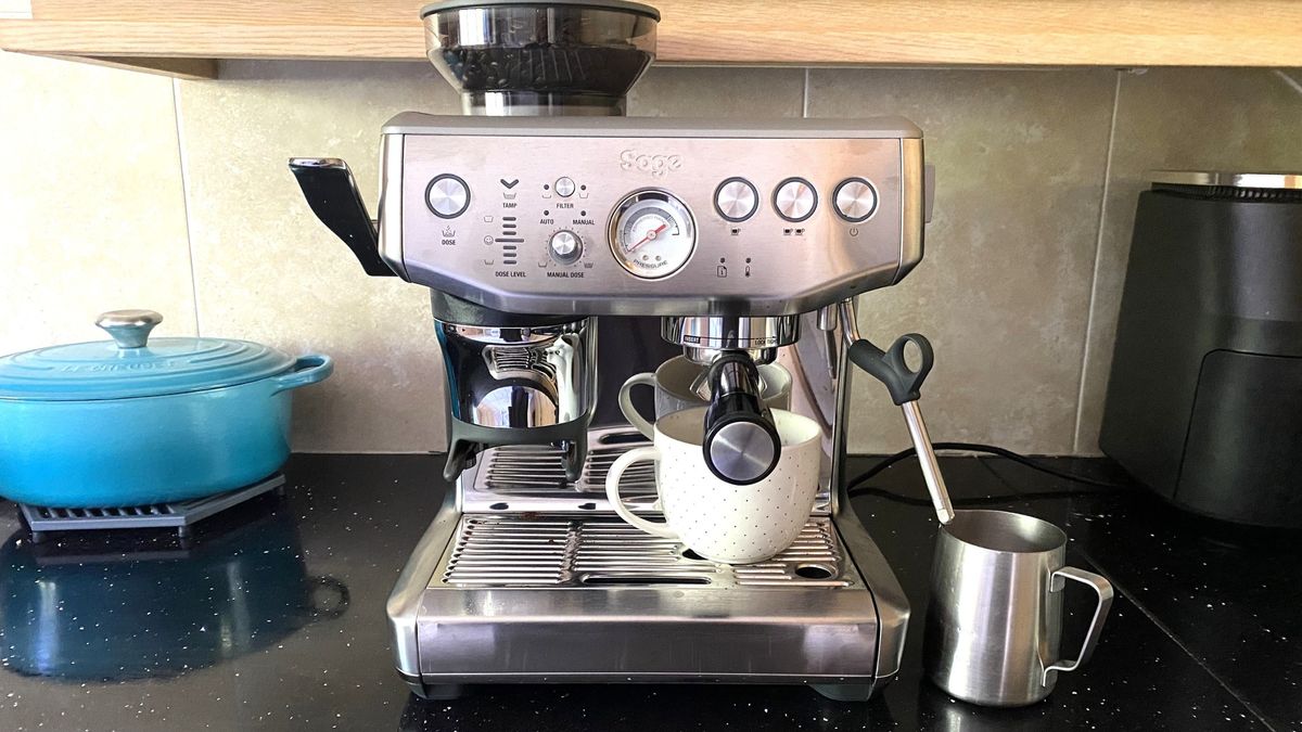 Breville Barista Express Impress coffee maker on kitchen counter