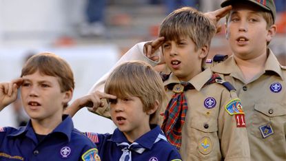 Scouts and cubs taking the scouting oath