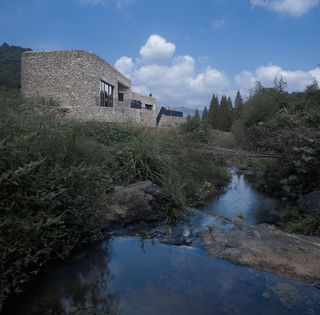 Water and stone clad museum in china