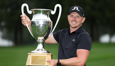 Matt Wallace holds the Omega European Masters trophy 