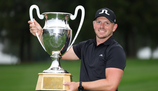 Matt Wallace holds the Omega European Masters trophy