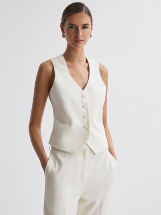 A white waistcoat from Reiss, perfect for a Carrie Bradshaw inspired look