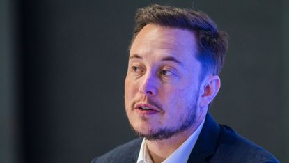 Tesla Motors CEO Elon Musk speaks at a press conference during the 67th International Astronautical Congress in Guadalajara, Mexico on September 27, 2016./ AFP / HECTOR GUERRERO(Photo credit 