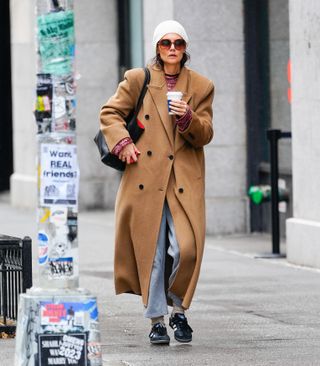 Katie Holmes wearing a camel double-breasted coat while out in NYC
