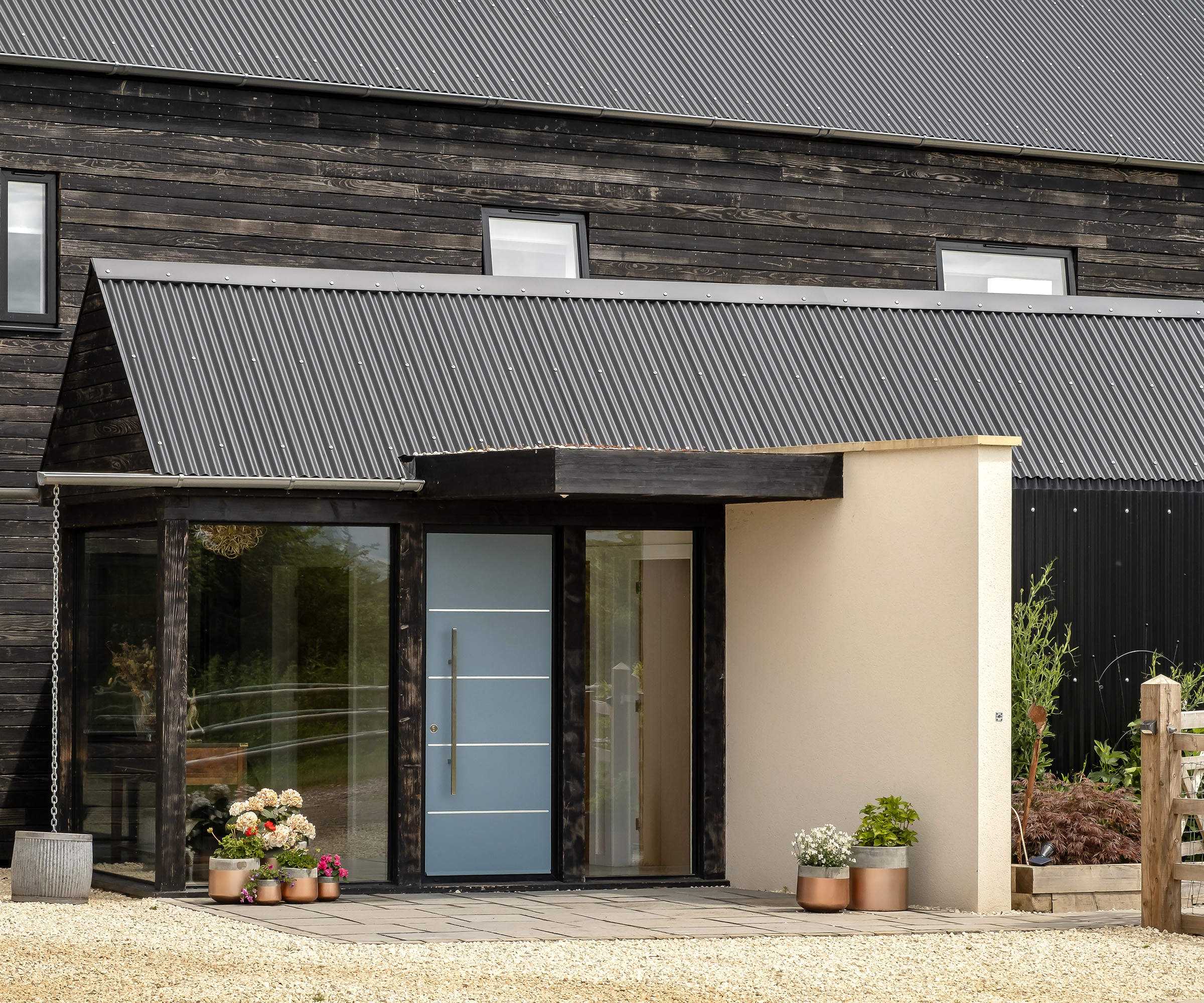 The contemporary front entrance and door of a brand new self build home