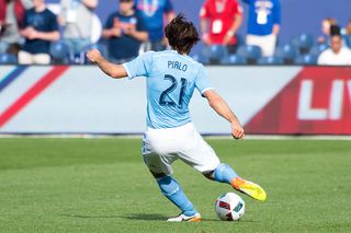 Midfielder Andrea Pirlo #21 of New York City FC kicks the ball forward during the match vs Vancouver Whitecaps at Yankee Stadium on April 30, 2016 in New York City. New York city FC won 3-2. 