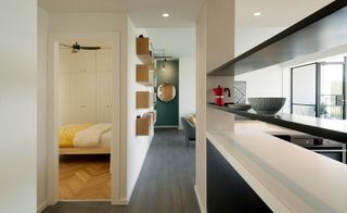 The apartment’s bedrooms are tucked away from the living spaces