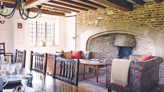 Large brick fireplace in a Tudor home