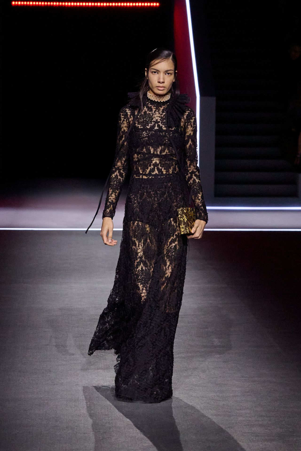 Dior models wear black lace dress
