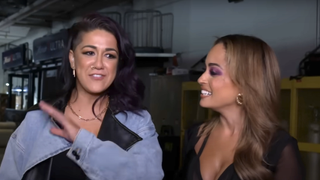 bayley and kayla braxton talk backstage during a wwe interview