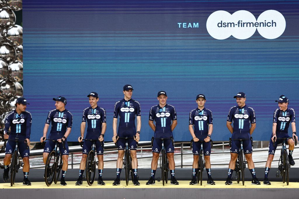 Team DSM Firmenich team riders take to the stage during the official teams presentation near the Guggenheim Museum Bilbao in Bilbao northern Spain on June 29 2023 two days prior to the start of the 110th edition of the Tour de France cycling race Photo by AnneChristine POUJOULAT AFP Photo by ANNECHRISTINE POUJOULATAFP via Getty Images