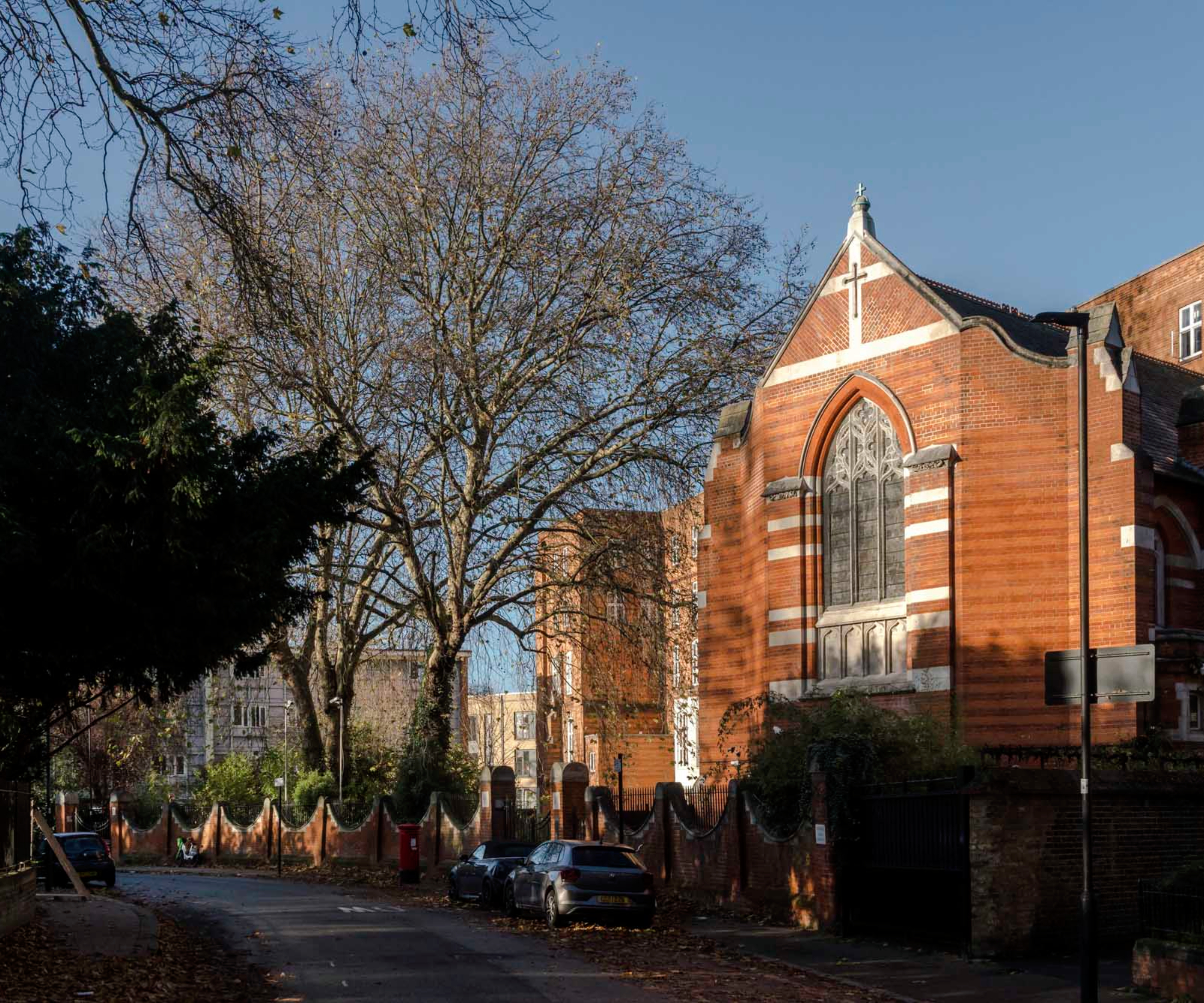 brick exterior of chapel conversion on tree lined street