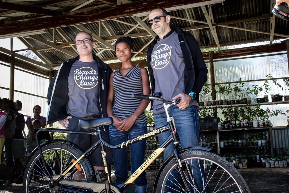 Representatives from Cervelo with one of the children present