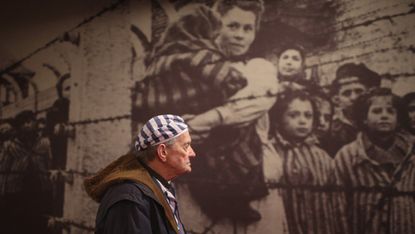 Holocaust survivor at an exhibition in the former Auschwitz concentration camp 