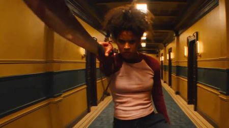 Zazie Beetz's unnamed hero brandishing a blade