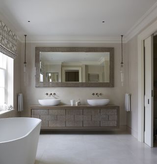 spa-like bathroom with closed storage