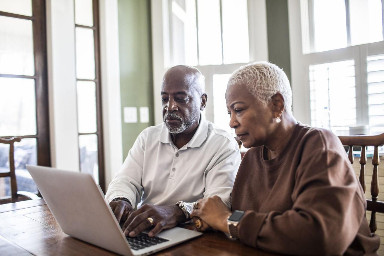 Older couple looking at laptop