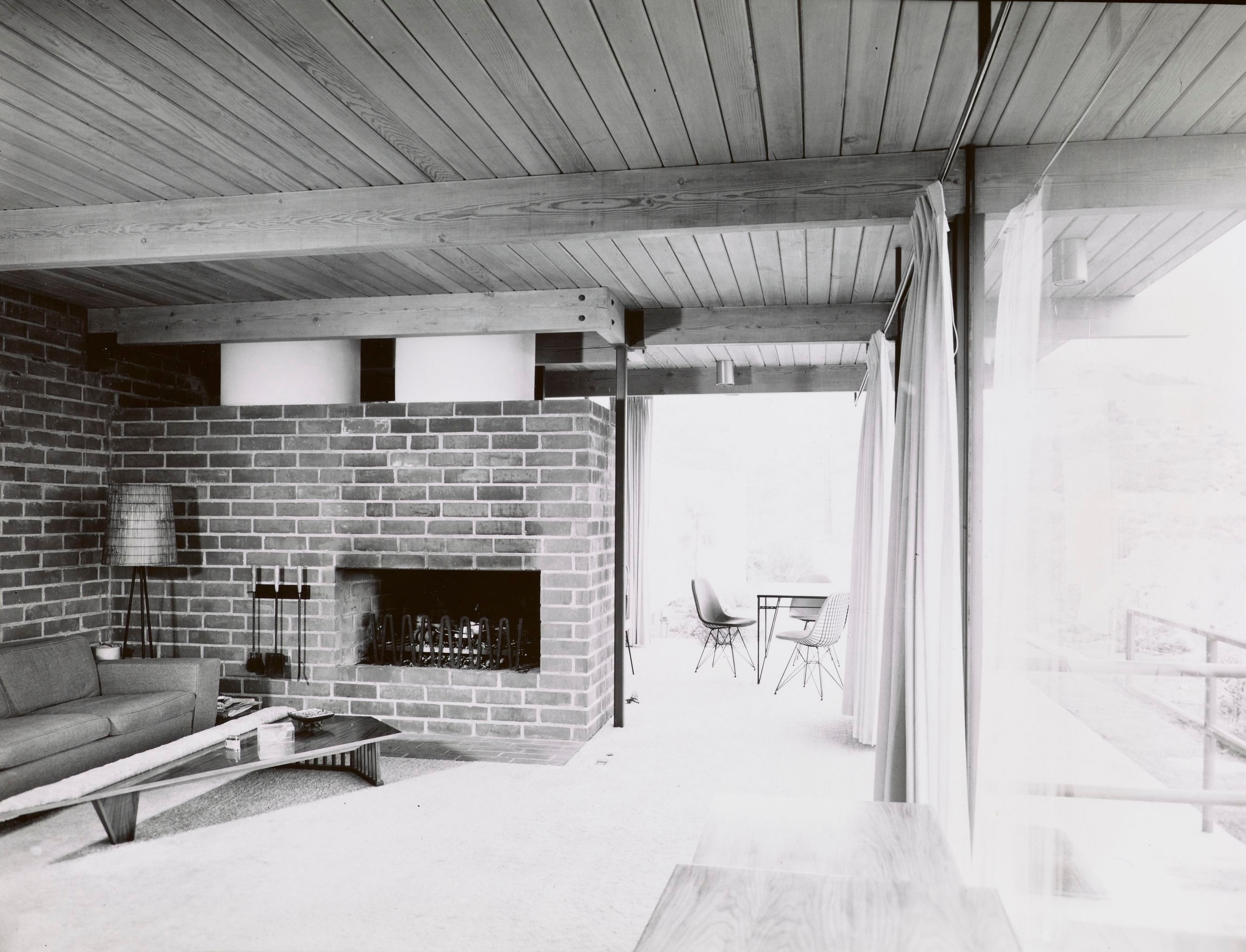 Modernist 1960s interiors of the homes in Crestwood hills. lots of glass, few walls, exposed brick