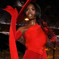 Olandria Carthen returned to Paris Couture Week wearing a red Robert Wun jumpsuit and matching hat