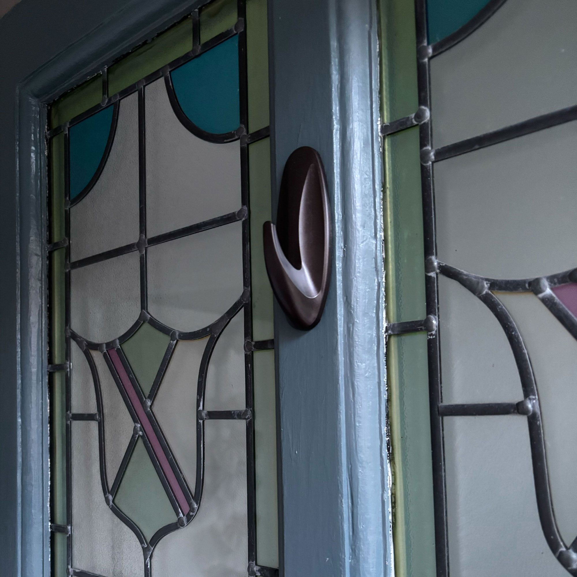 Blue front door with green wreath