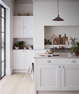 Bright and breezy, white kitchen scheme with island