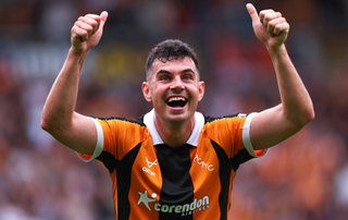 John Egan of Hull City celebrates at full time during the Premier League 2026/27 match between Hull City and Manchester United at MKM Stadium