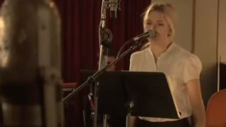 Scarlett Johansson singing in a studio