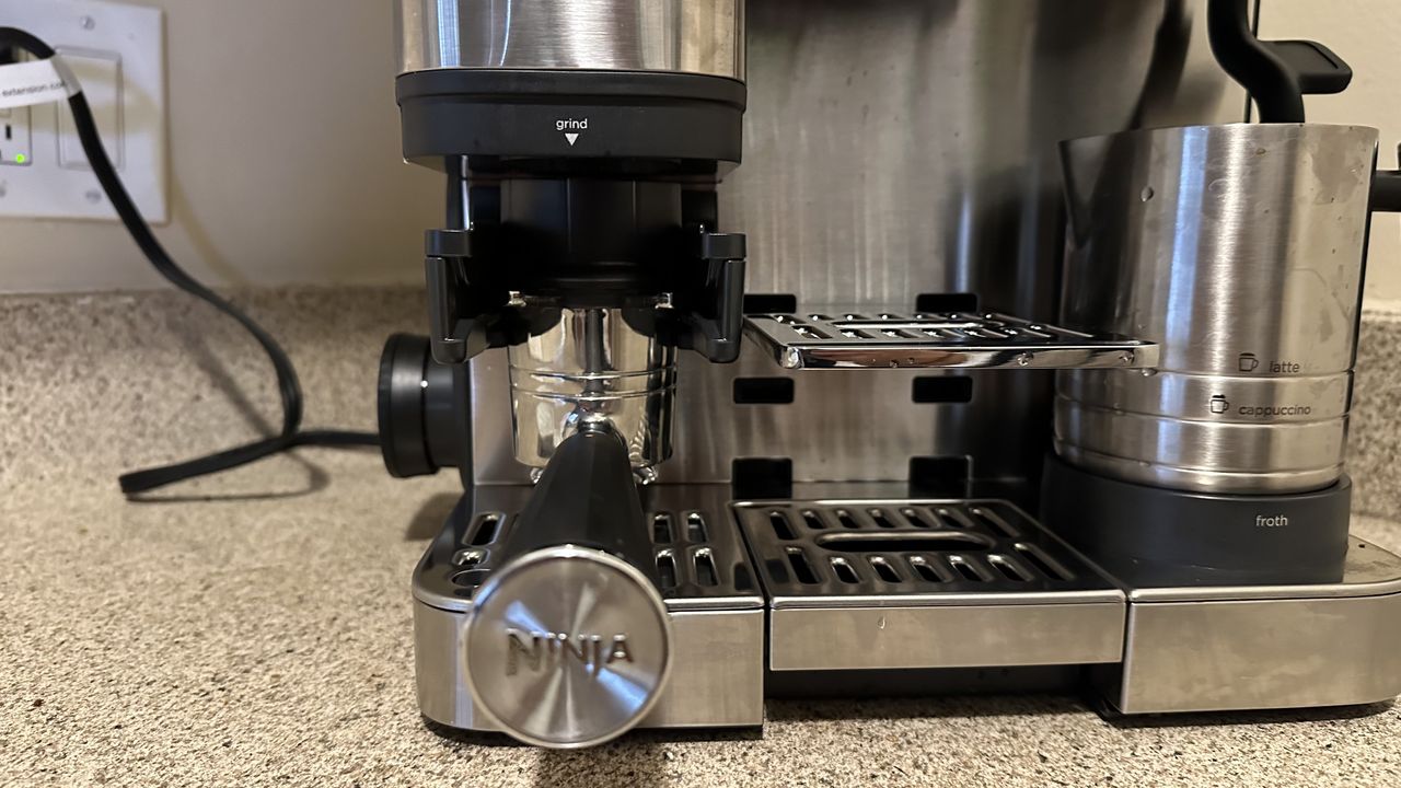 Portafilter inserted into grinder of Ninja Luxe Caf&eacute; coffee maker