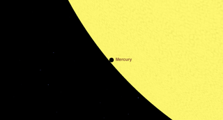 At 7:09 a.m. EDT on May 9, Mercury will be just inside the limb of the sun; notice the "black drop" effect.