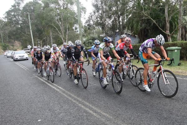 A breakaway group trying to catch a solo rider out in front.