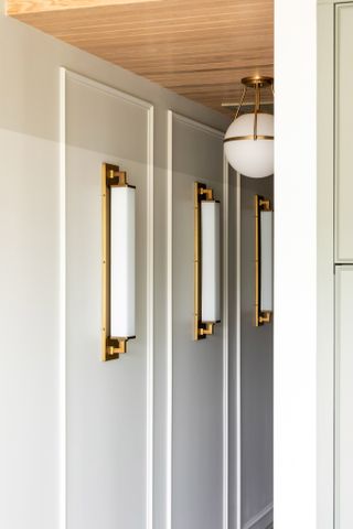 Small hallways with brass light fittings